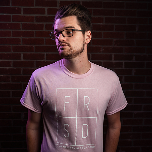 aaron griffin wearing light pink band t-shirt from the farside